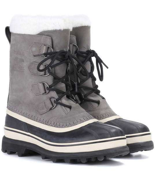 Caribou®皮革和橡胶靴子展示图