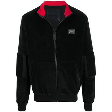 zipped up jogging jacket