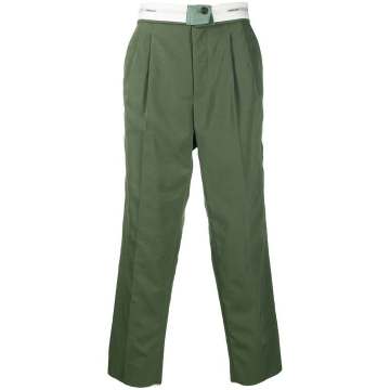 folded loose trousers